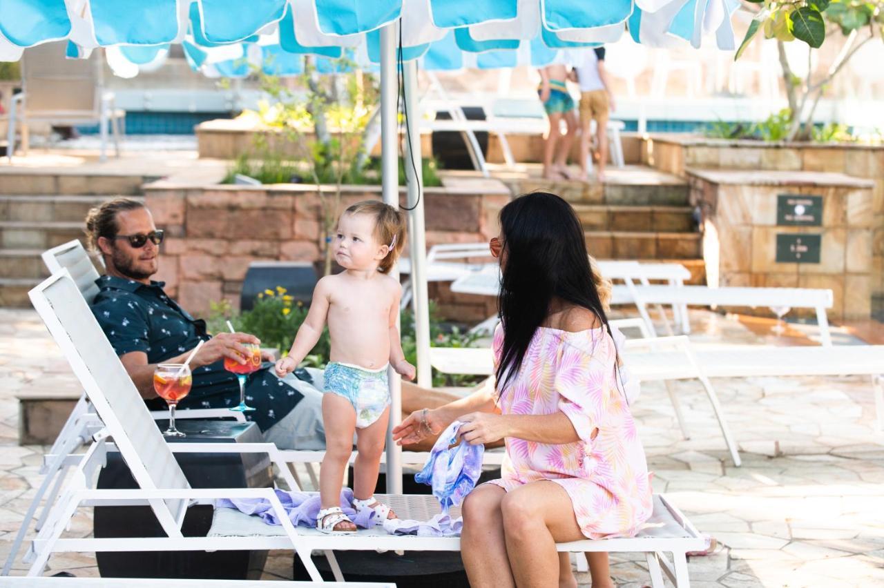 The Capital Zimbali Hotel Ballito Exterior foto Family at the pool