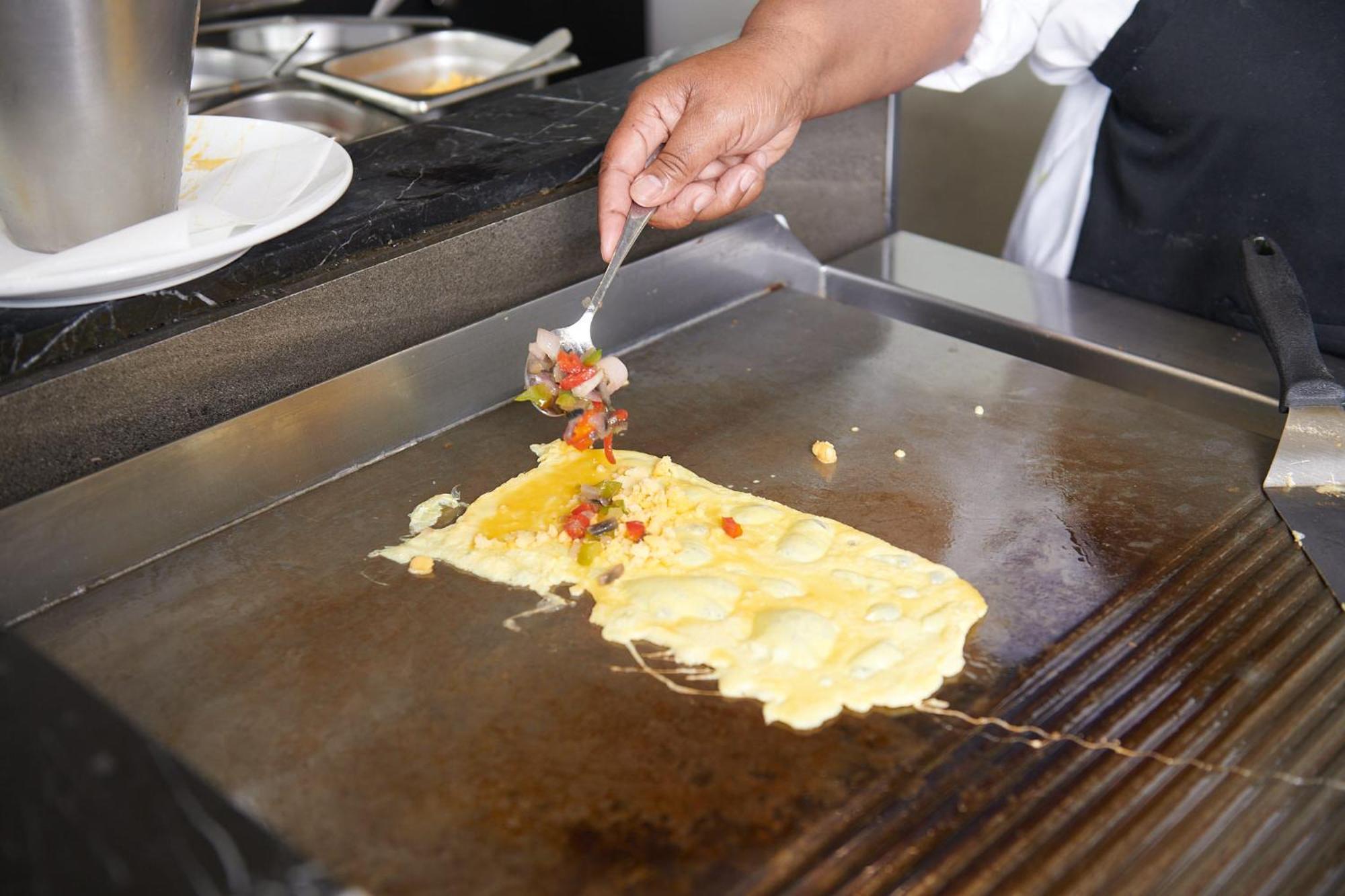 The Capital Zimbali Hotel Ballito Exterior foto Preparation of an omelette